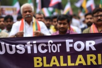 A photo of a protest in Bengaluru with a banner that reads "Justice for Ballari" in the foreground, and a blurred image of a politician in the background.