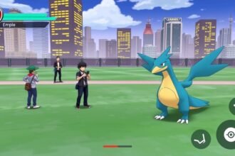 A screenshot of Empoleon in a Pokémon Go battle, with a cityscape in the background and a few players standing around, looking at their phones.