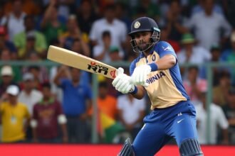 A photo of Vaibhav Suryavanshi in action during the India U19 vs South Africa U19 match, with a focus on his batting stance and a background of excited spectators