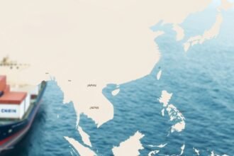 A map of East Asia with China and Japan highlighted, with a background of trade ships and cargo containers