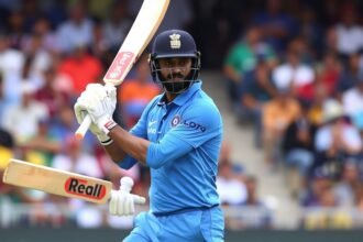A photo of KL Rahul batting in the middle, with a focus on his concentration and technique, set against a backdrop of a crowded stadium with fans cheering.
